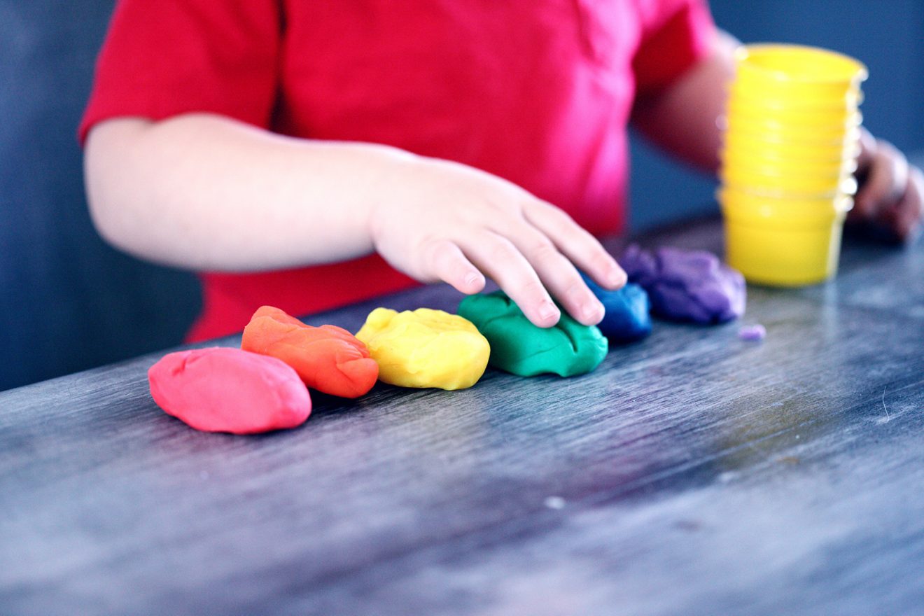 child playing with play dough